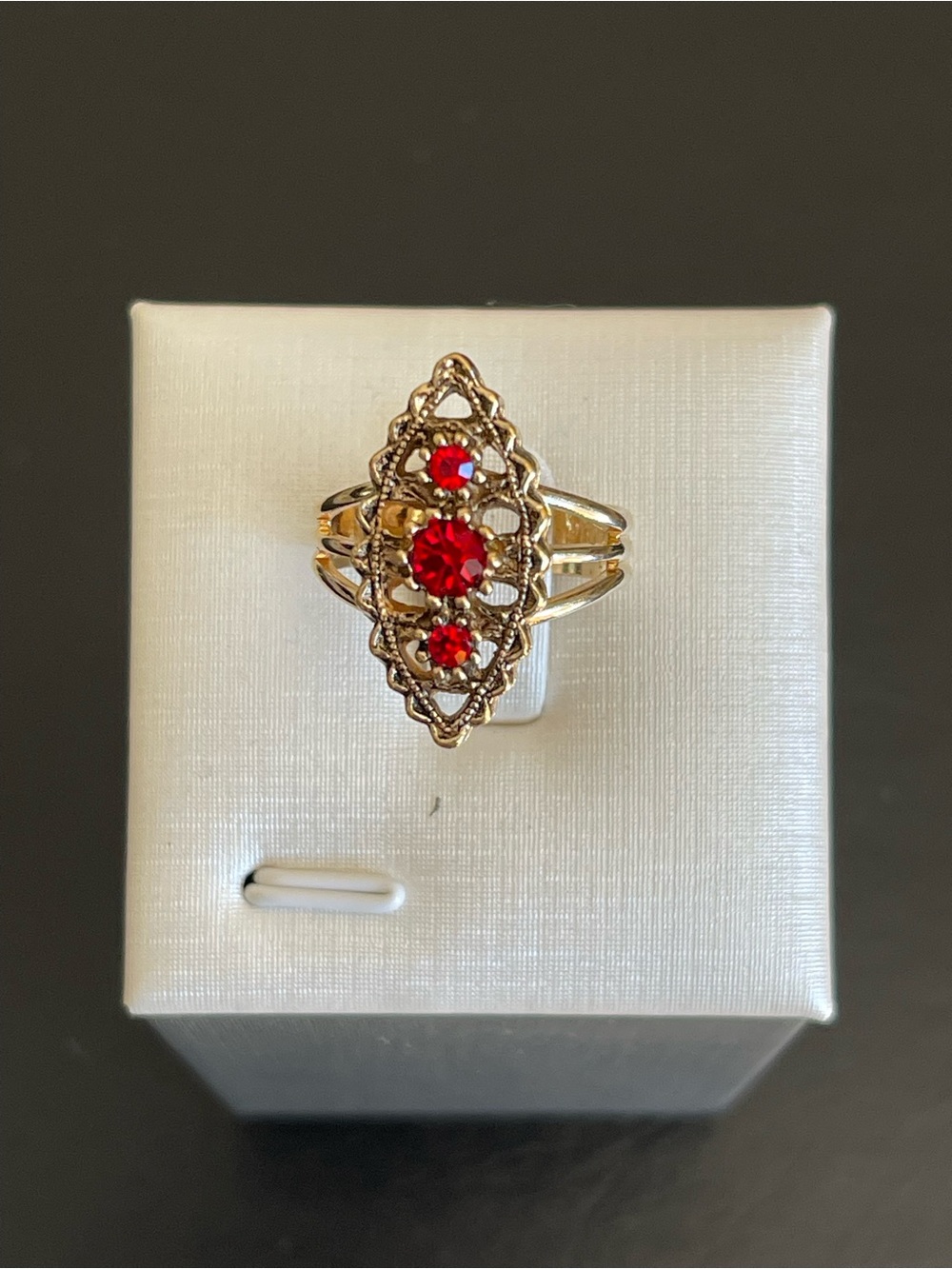 Vintage Sarah Coventry red rhinestone adjustable ring.